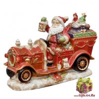 Дед мороз в старинном стиле на автомобиле с подарками. Керамика. Длина 29,5 см