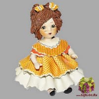 Статуэтка &quot;Кукла сидящая с темными волосами в оранжевом платье&quot;