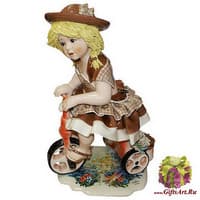 Статуэтка &quot;Кукла на велосипеде в св. коричневом платье&quot;