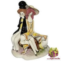 Скульптура &quot; Пара сидящая на тележке&quot;