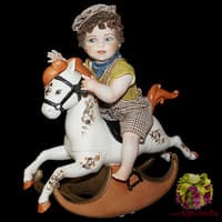 Кукла Мальчик сидящий на лошадке-качалке Sibania Италия