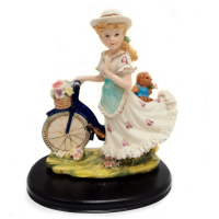 Статуэтка Маленькая леди на велосипеде. Фарфор. Высота 30 см.
