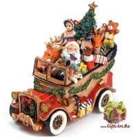 Санта с друзьями на машине везёт подарки детям. Музыкальная фигурка.  Длина 22 см