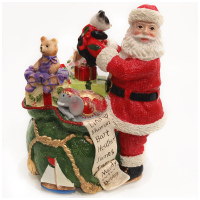 Дед мороз c мешком подарков. Музыкальная фигурка. Высота 18 см.