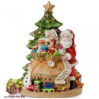 Дед мороз  c подарками у ёлки. Музыкальная фигурка. Высота 20 см